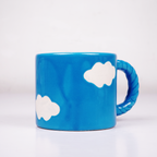 Blue Ceramic Coffee Mug with White Cloud Design & Textured Handle