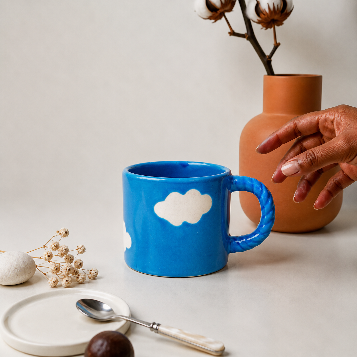 Blue Ceramic Coffee Mug with White Cloud Design & Textured Handle